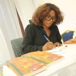 The writer Awondo Calixte signs her book titled  " My passion, my Country " published by Ifrikya editions